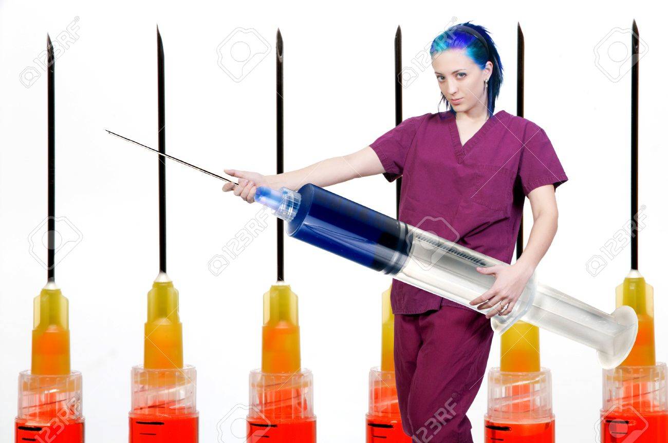 8892717-a-medical-doctor-or-nurse-in-scrubs-preparing-an-injection-in-a-giant-syringe